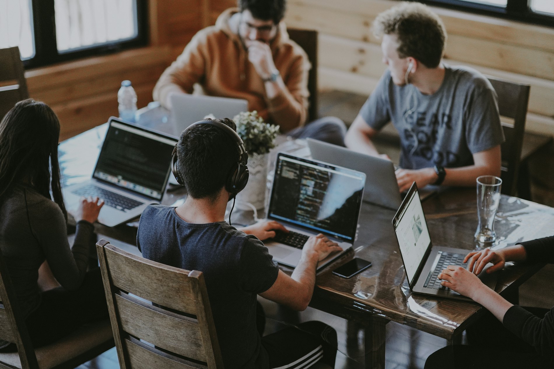 A growing team at work around one table
